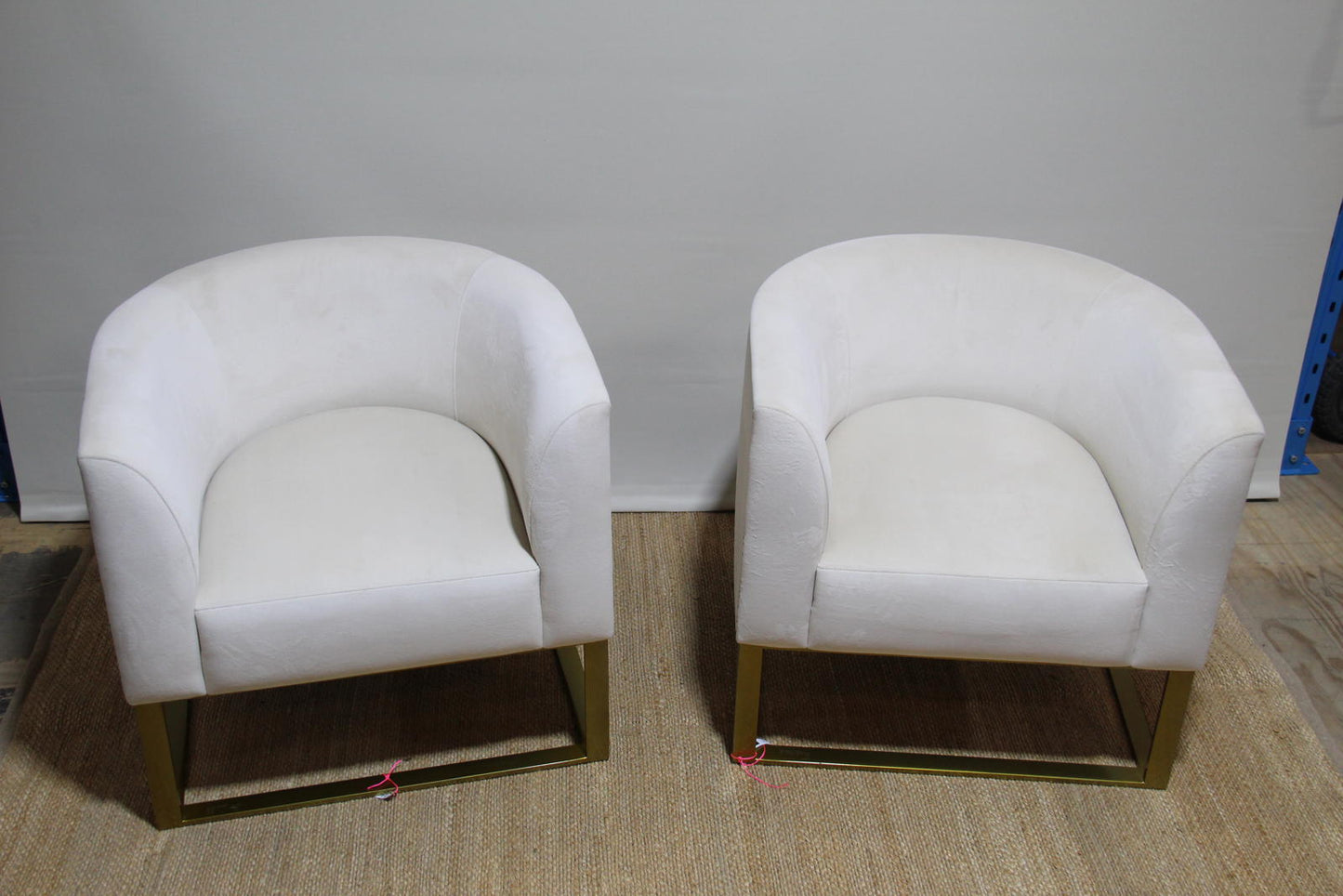 White barrel chairs with brass base made by Interdesign