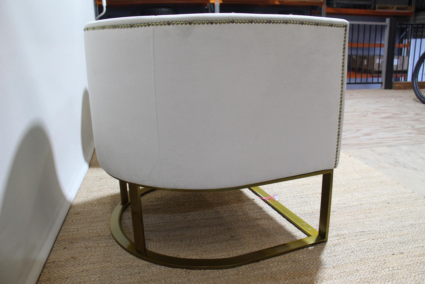 White barrel chairs with brass base made by Interdesign