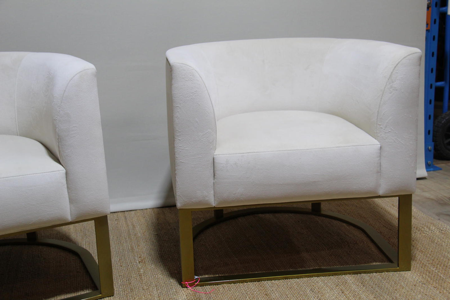 White barrel chairs with brass base made by Interdesign