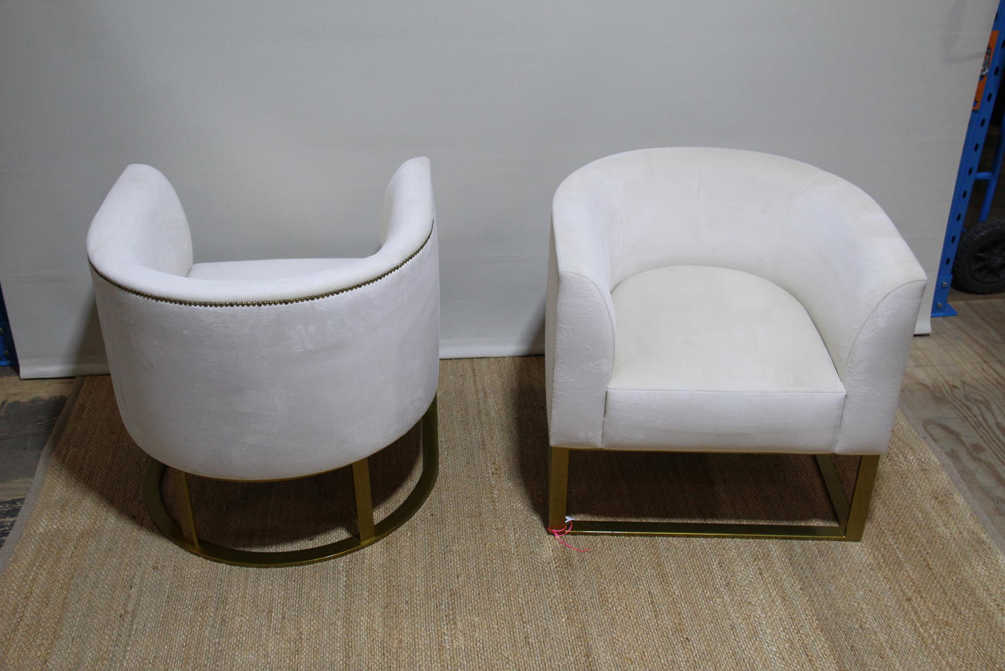 White barrel chairs with brass base made by Interdesign