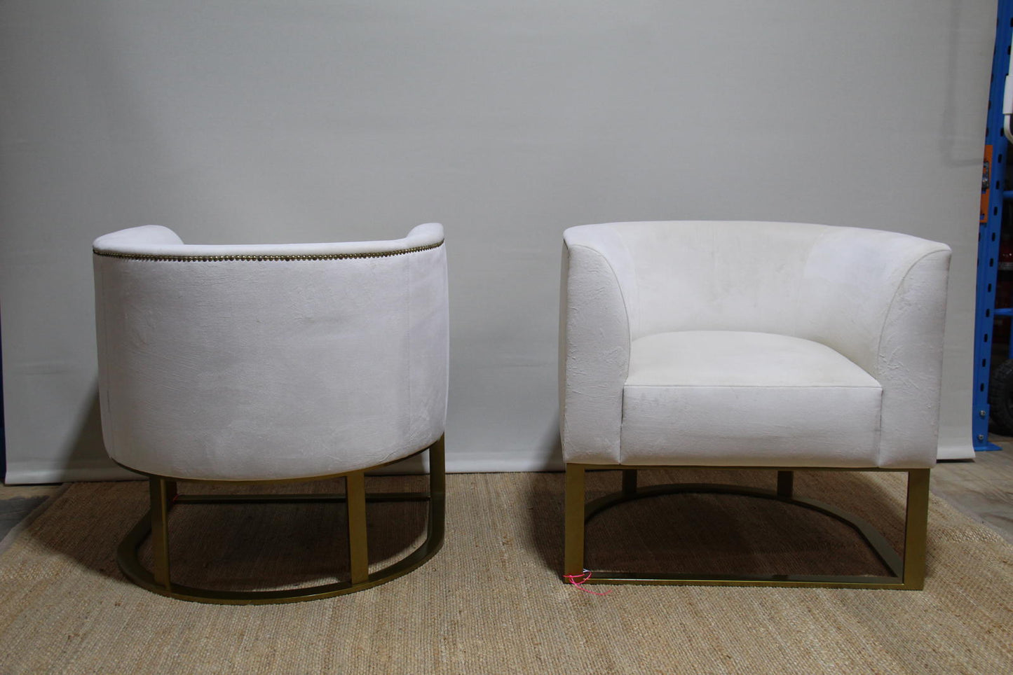 White barrel chairs with brass base made by Interdesign