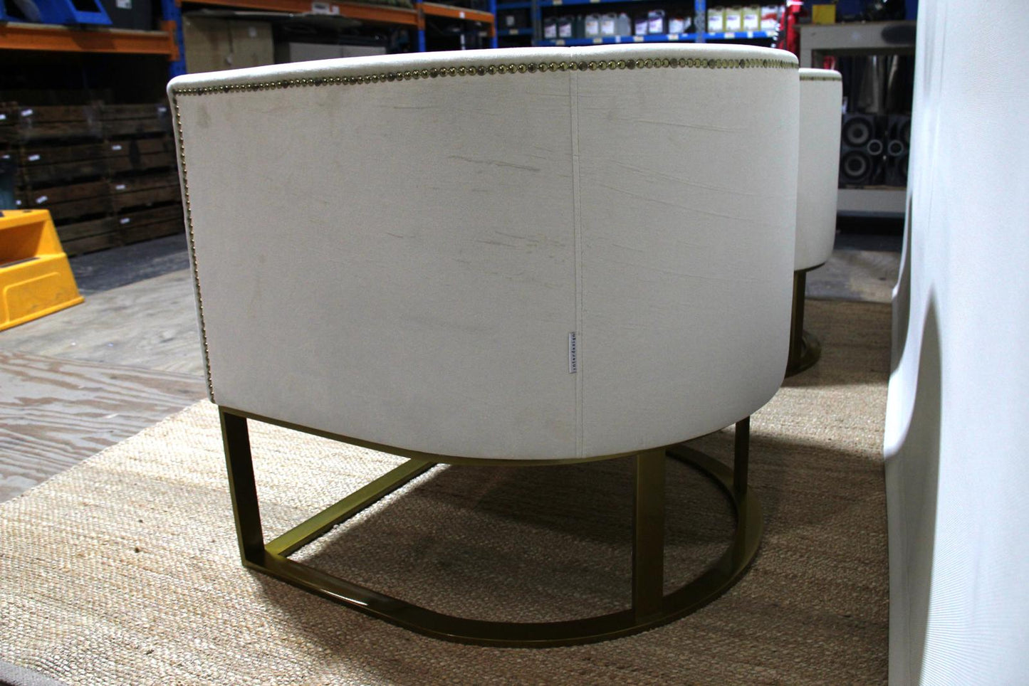 White barrel chairs with brass base made by Interdesign